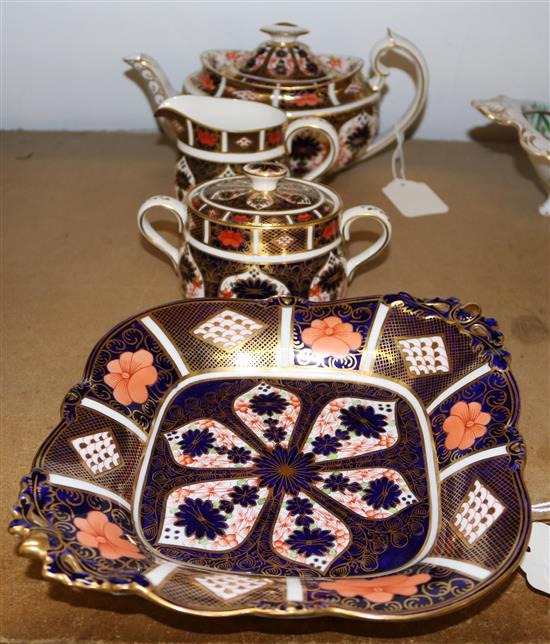 Royal Crown Derby three-piece teaset, pattern 1128 and a cake dish, pattern 1685